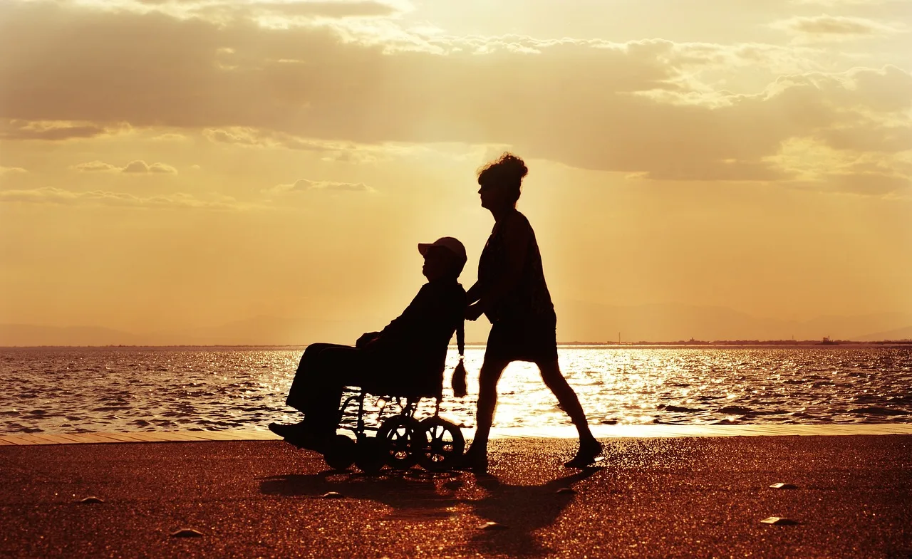 wheelchair, walk, nature, care, disabled, couple, sea, sunset, characters. Accessible US travel itinerary planning: one anchor a day