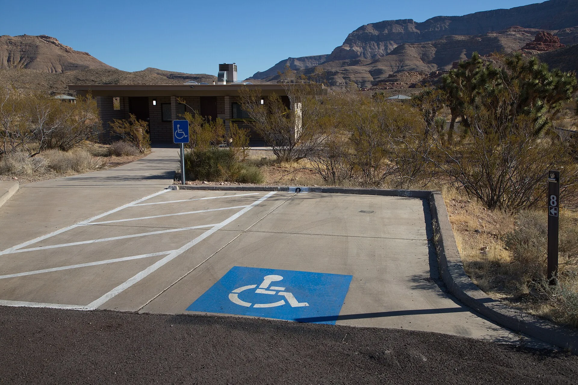 Campsite 8 is wheelchair accessible. It has a cement parking spot with room for side-entry van. This is also the closest parking for the south restroom. It is adjacent to campsites 5, 6, and 7, which are not accessible. Photo by the Bureau of Land Management Arizona. Choosing Accessible Tour Operators by Service Model